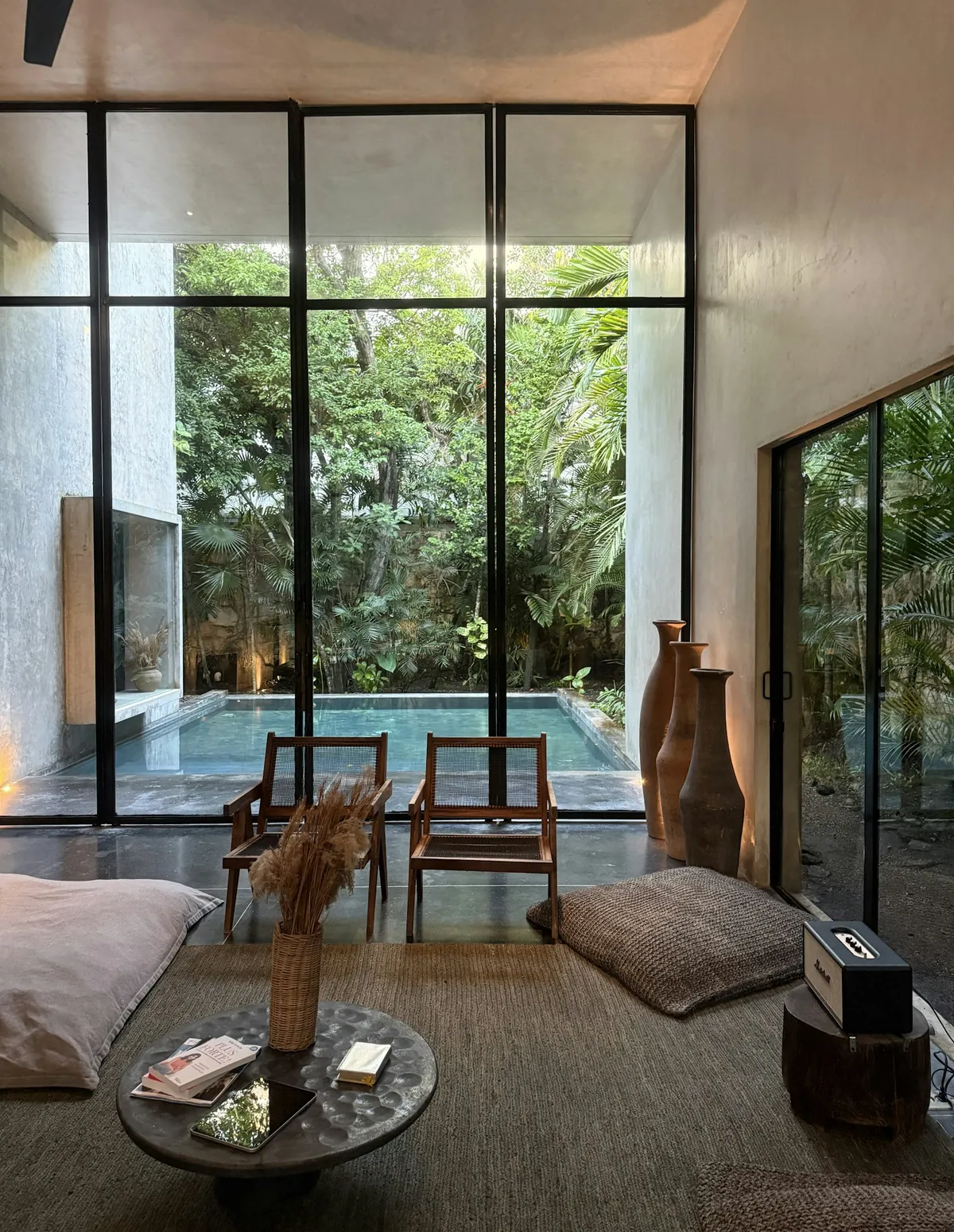 Villa living room opening onto a pool courtyard